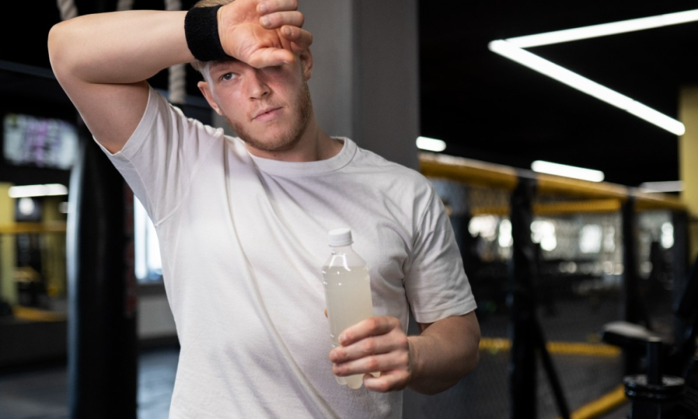medium shot tired man holding drink