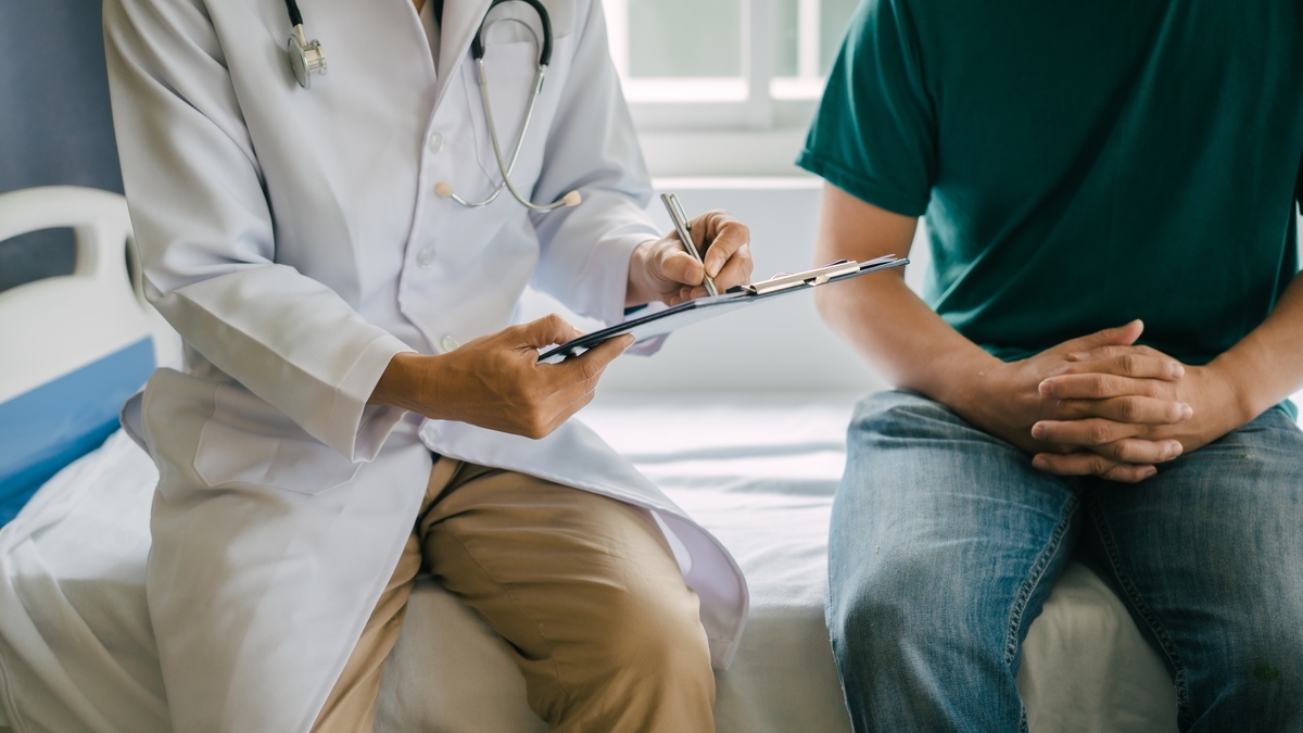 Doctor explaining Signs You Need TRT in Chesapeake, VA