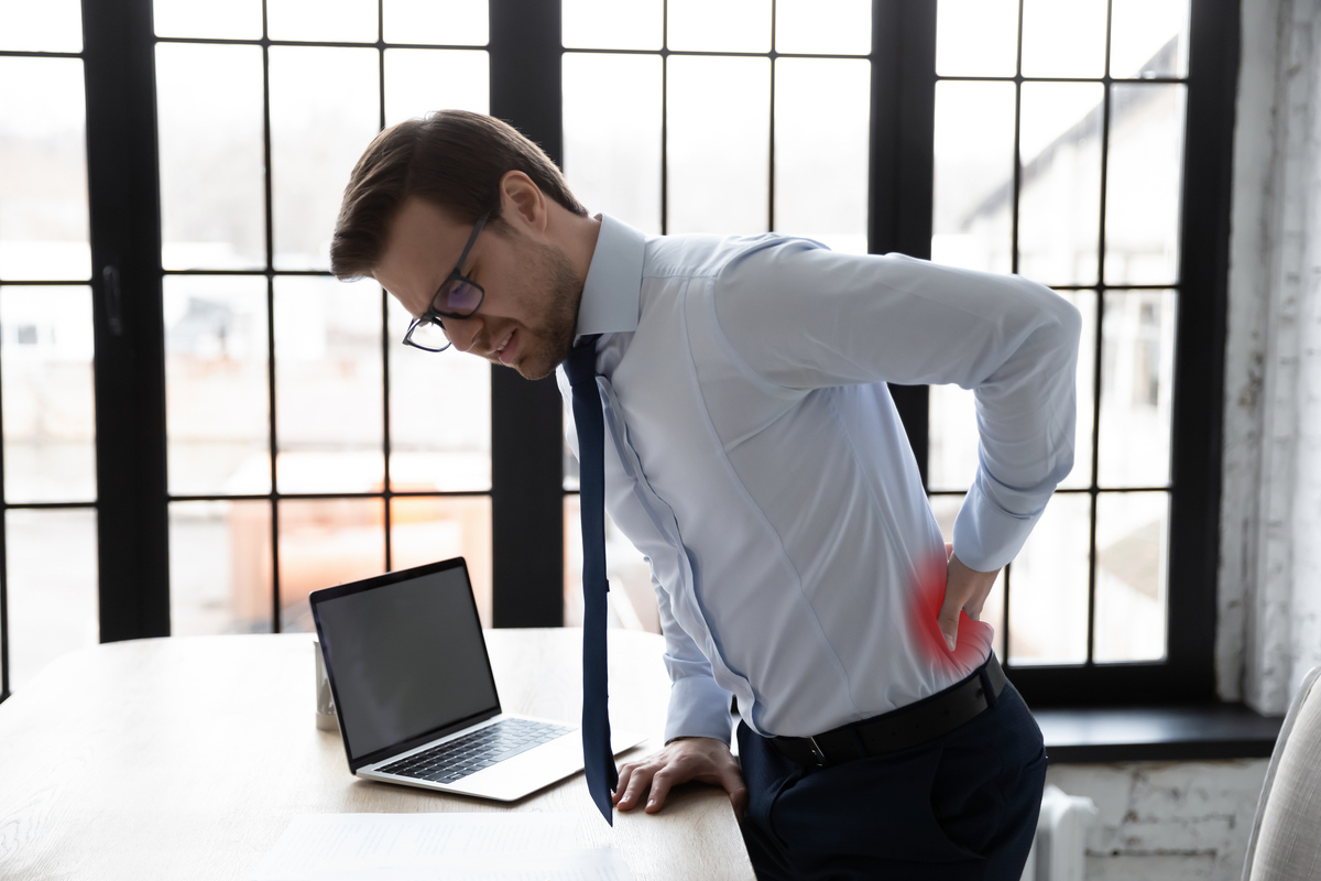 Man with back pain showing effects of low testosterone and bone health decline in Norfolk VA